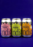 Load image into Gallery viewer, Three cans of indigo, side by side on a blue background. From left to right is the Raspberry, habanero and lime, Pear, elderflower and cardamom and the Mandarin, bergamot and lemon myrtle sodas.
