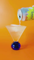 Load and play video in Gallery viewer, Pouring pear elderflower and cardamom soda, the soda is bubbling and fizzing
