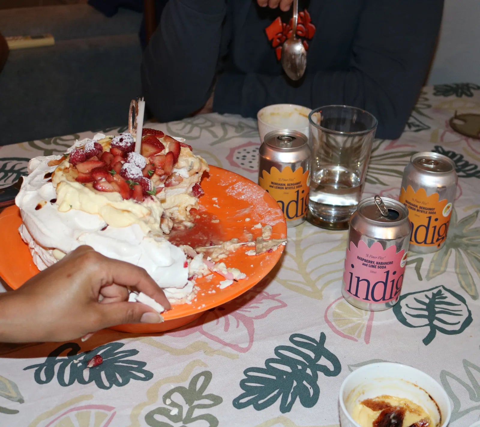 indigo Mandarin, Bergamot & Lemon Myrtle and Raspberry, Habanero & Lime sodas on a dinner table next to a strawberry pavlova